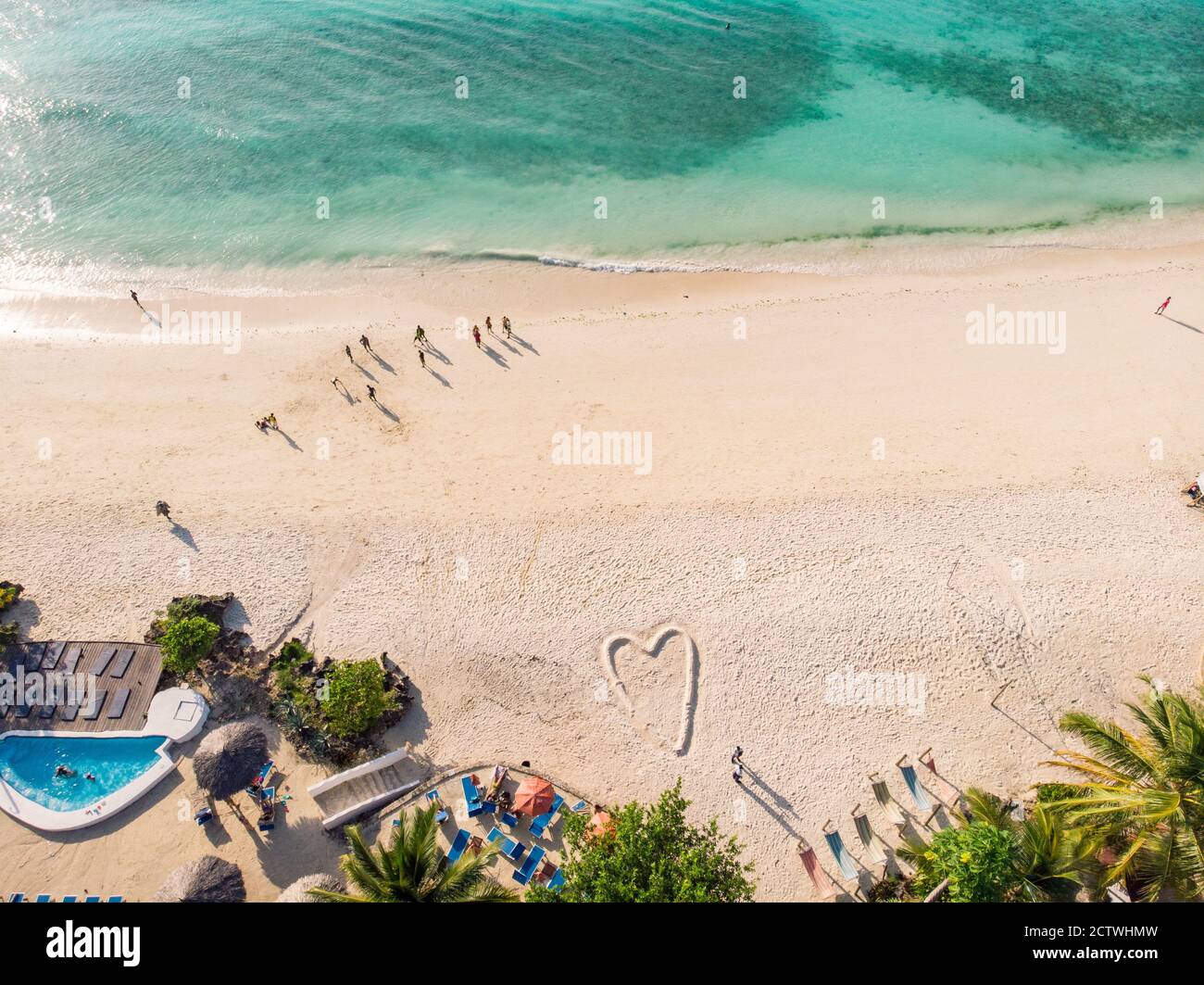 Top Aerial view on the beautiful white sand ocean coast in Nungwi at Zanzibar island, Tanzania Stock Photo