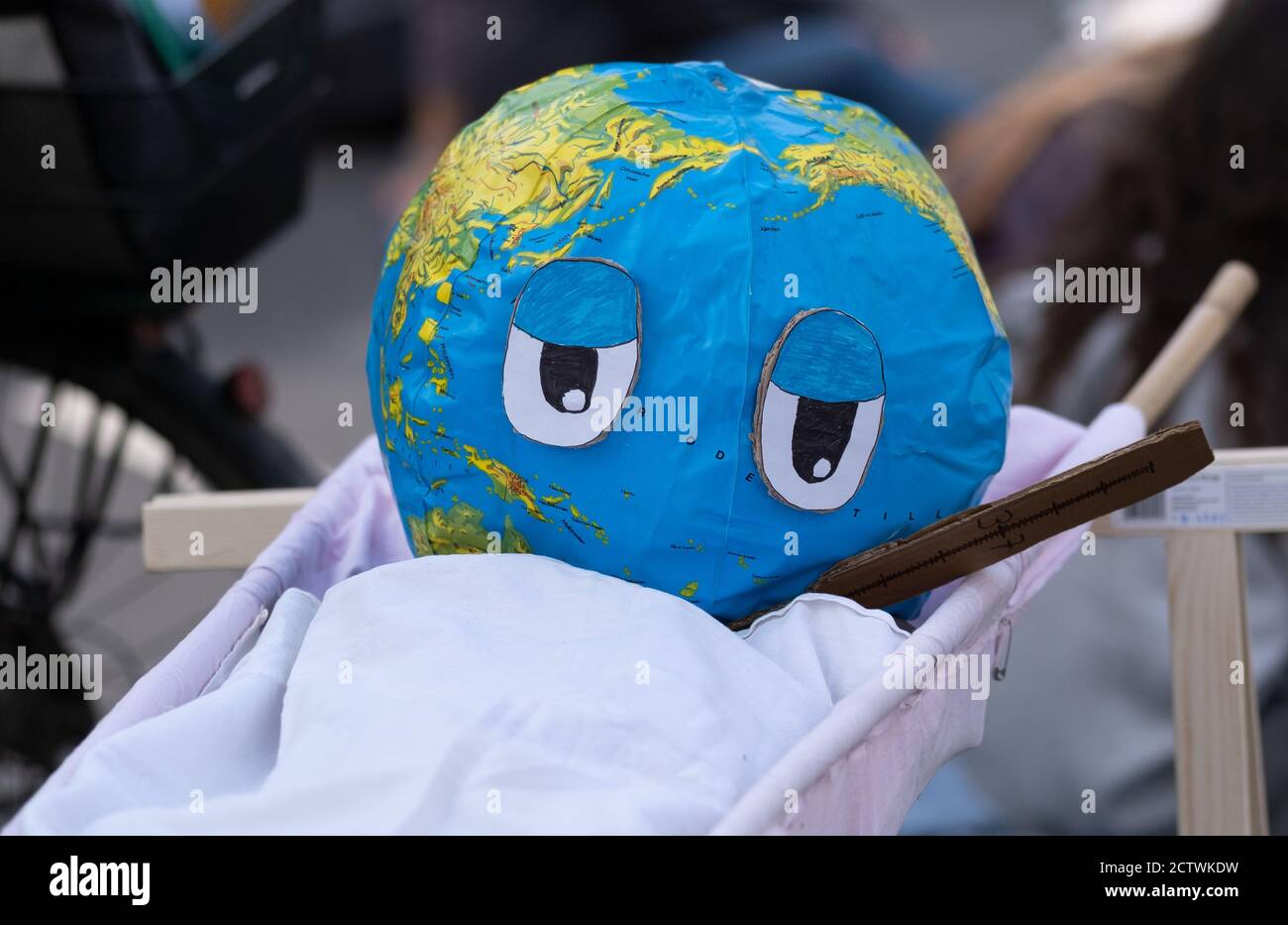 Hanover, Germany. 25th Sep, 2020. A papier-mâché globe with a thermometer was built during the global climate strike of the climate protection movement Fridays for Future. Under the motto 'Not one degree further' Fridays for Future calls for a global climate strike to set a strong signal for climate justice together. The German protests focus on the topic of energy system transformation. Credit: Peter Steffen/dpa/Alamy Live News Stock Photo