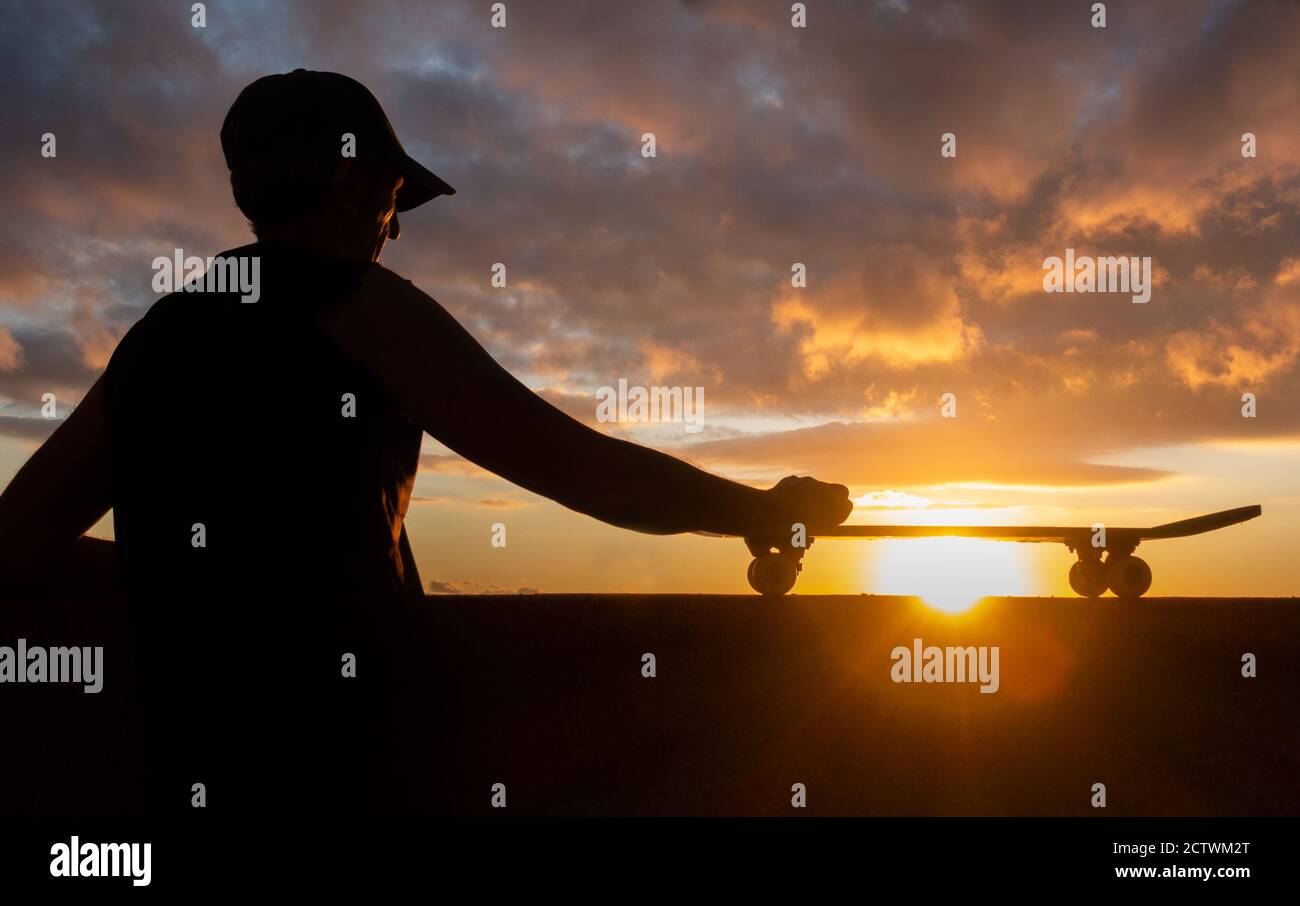 Skateboarding: Skateboarder at sunset. Stock Photo