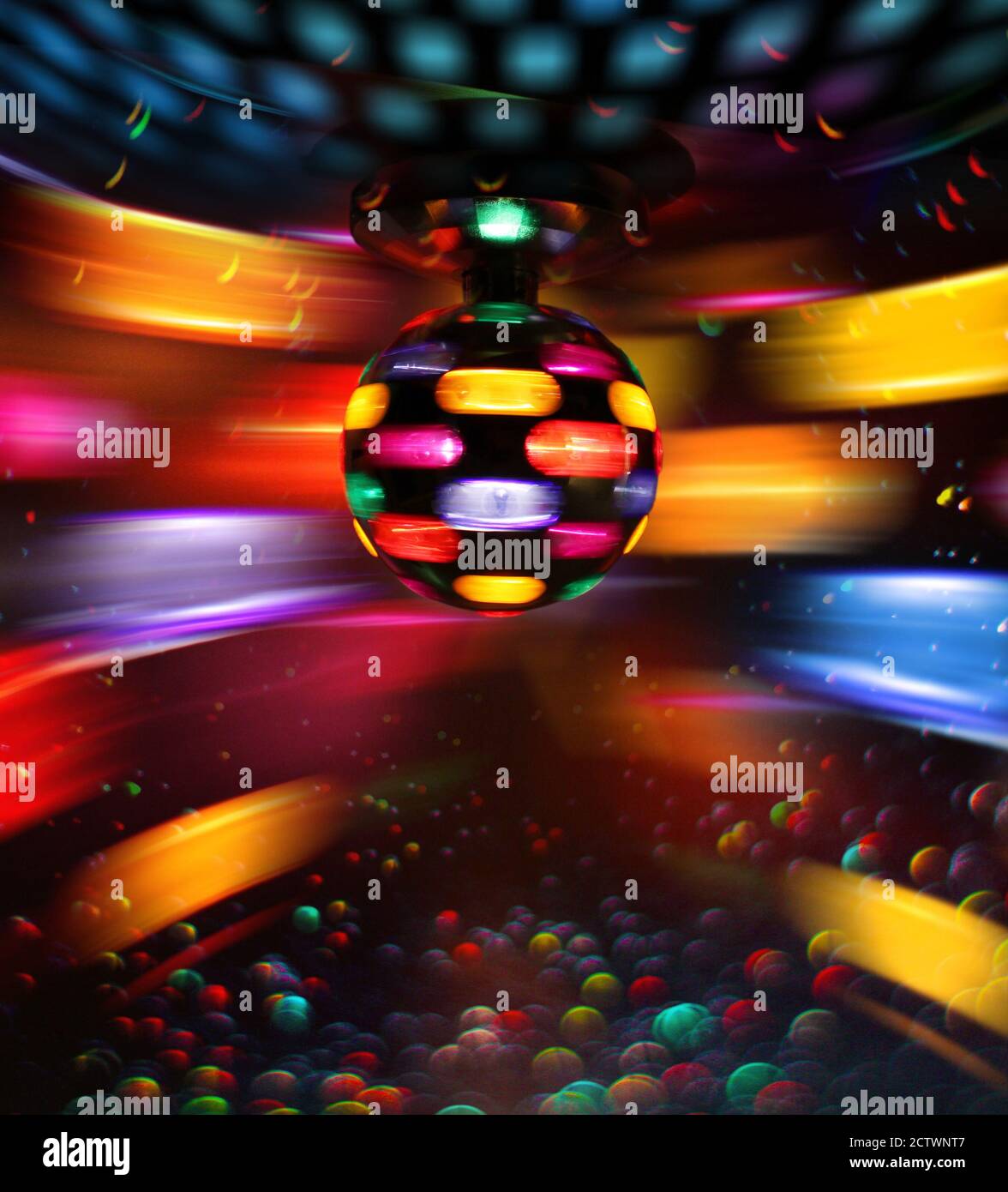 Colorful disco ball rotating light spot reflections on wall and floor Stock  Photo - Alamy