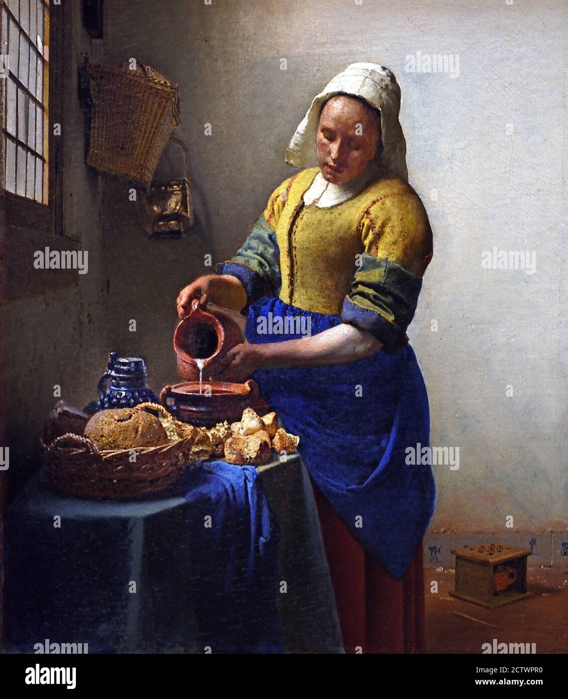 The Kitchen Maid Milkmaid -  Het melk meisje (1658-1660)  Johannes Jan Vermeer  Dutch, Delft 1632–1675 Delft Netherlands Stock Photo