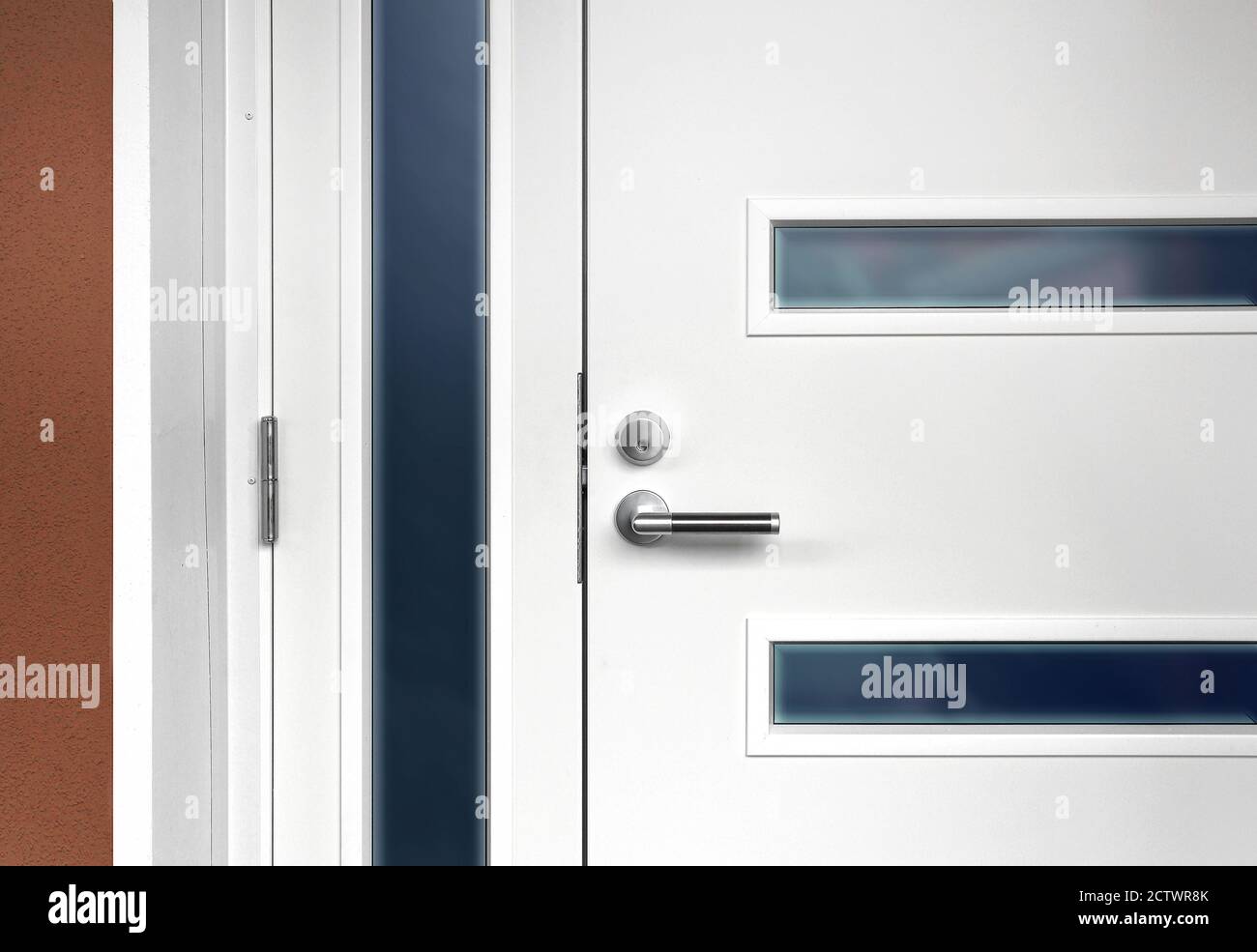 Modern white front door with metal fixture handle and glass windows