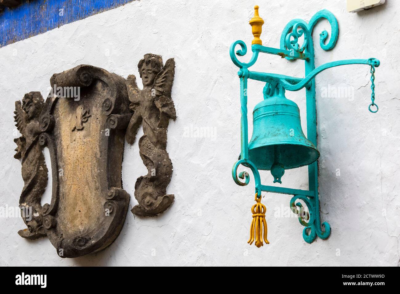 A sculpture and bell in the beautiful Battery Square in Portmeirion