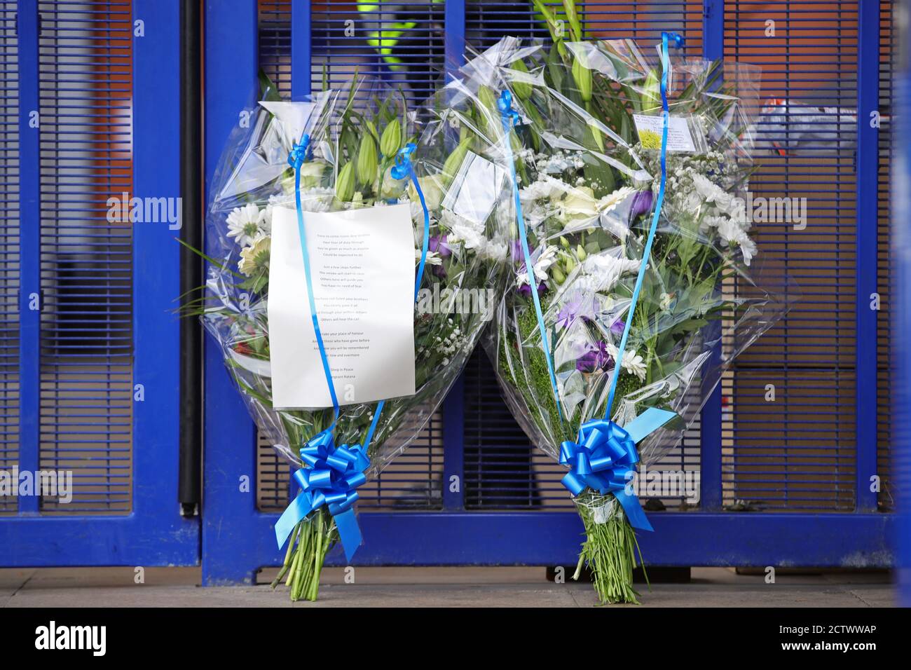 Flowers left outside Croydon Custody Centre in south London where a police officer was shot by a man who was being detained in the early hours of Friday morning. The officer was treated at the scene before being taken to hospital where he subsequently died. Stock Photo