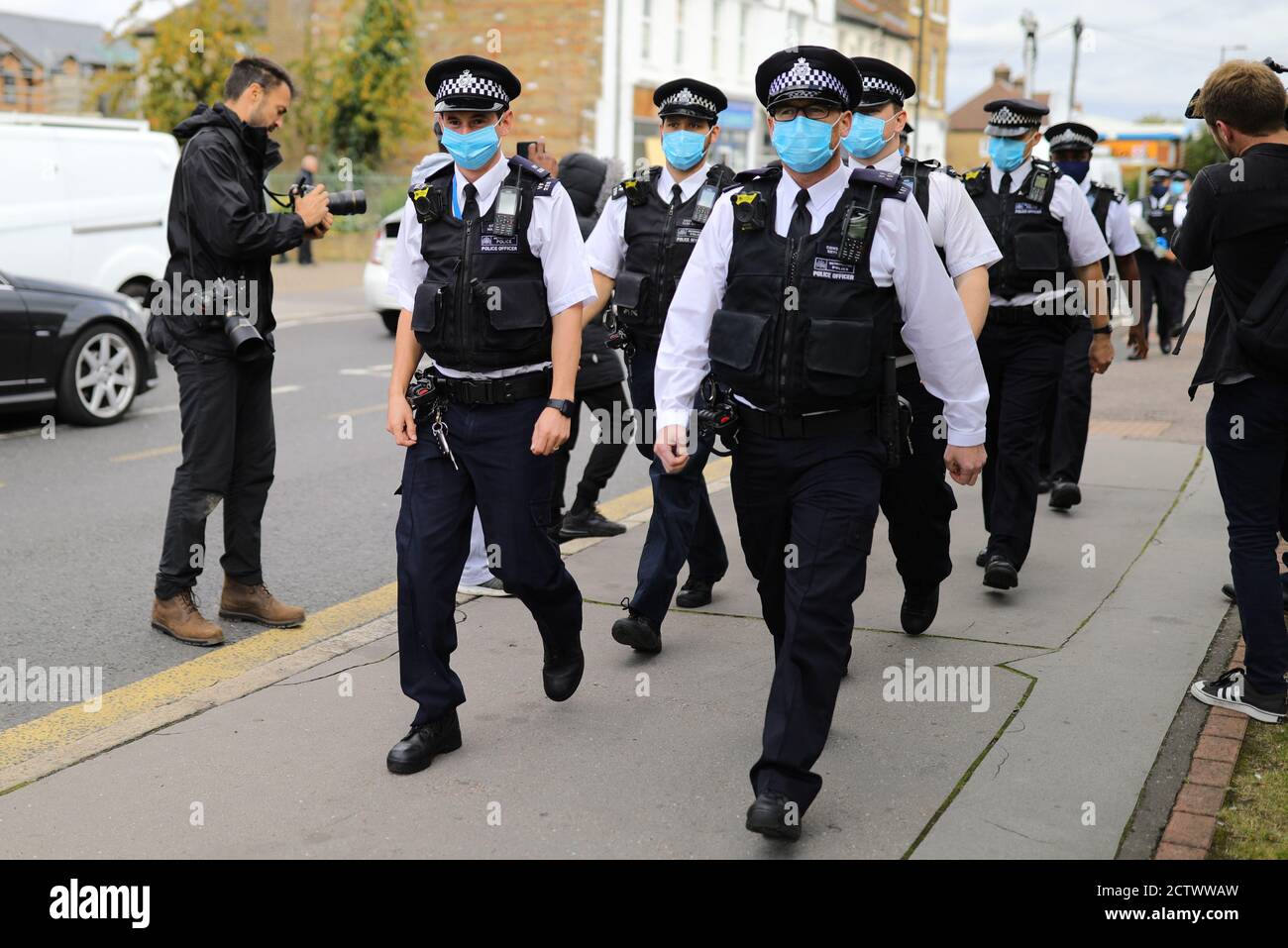 Police officers arrive to pay their respects at Croydon Custody Centre in south London where a police officer was shot by a man who was being detained in the early hours of Friday morning. The officer was treated at the scene before being taken to hospital where he subsequently died. Stock Photo