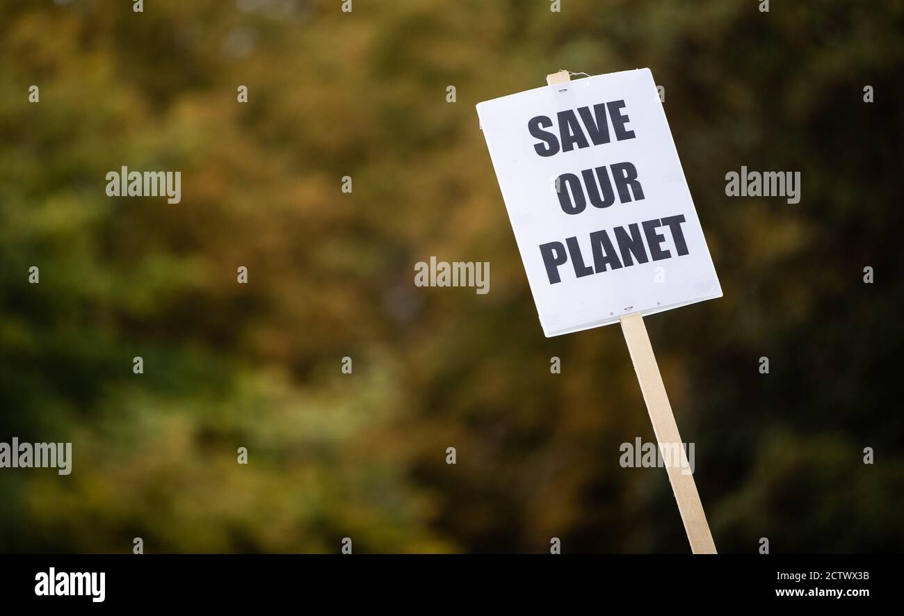 25 September 2020, Baden-Wuerttemberg, Stuttgart: ""Save our Planet"" is written on the poster of a participant in the global climate strike of the climate protection movement Fridays for Future. The climate movement Fridays for Future has called for a worldwide day of action after months of protests mainly on the internet. Photo: Christoph Schmidt/dpa Stock Photo