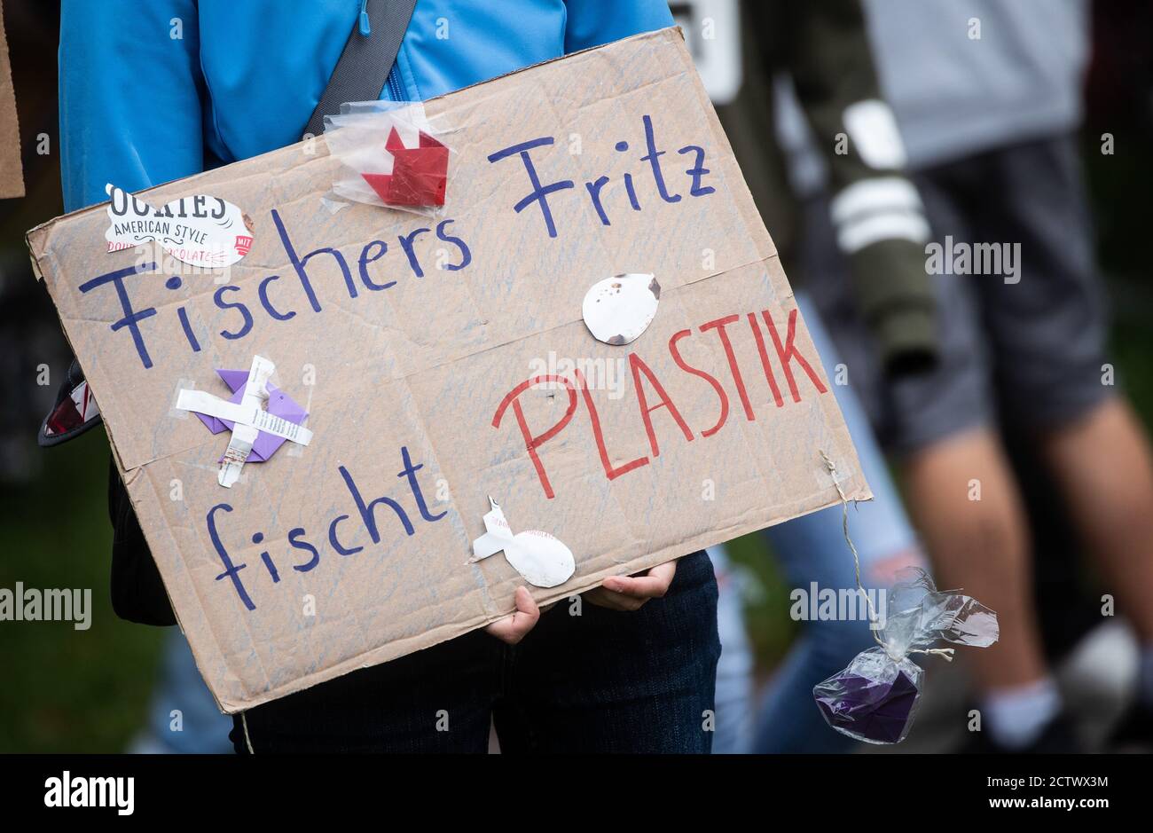 25 September 2020, Baden-Wuerttemberg, Stuttgart: ""Fisherman Fritz fishes plastic"" is written on the poster of a participant in the global climate strike of the climate protection movement Fridays for Future. The climate movement Fridays for Future has called for a worldwide day of action after months of protests mainly on the internet. Photo: Christoph Schmidt/dpa Stock Photo