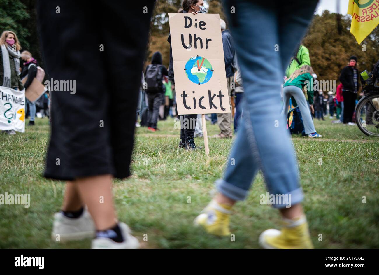 25 September 2020, Baden-Wuerttemberg, Stuttgart: ""The clock is ticking"" is written on the poster of a participant in the global climate strike of the climate protection movement Fridays for Future. The climate movement Fridays for Future has called for a worldwide day of action after months of protests mainly on the internet. Photo: Christoph Schmidt/dpa Stock Photo