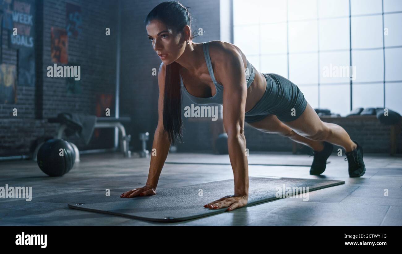 strong-and-fit-athletic-woman-in-sport-top-and-shorts-is-doing-push-up