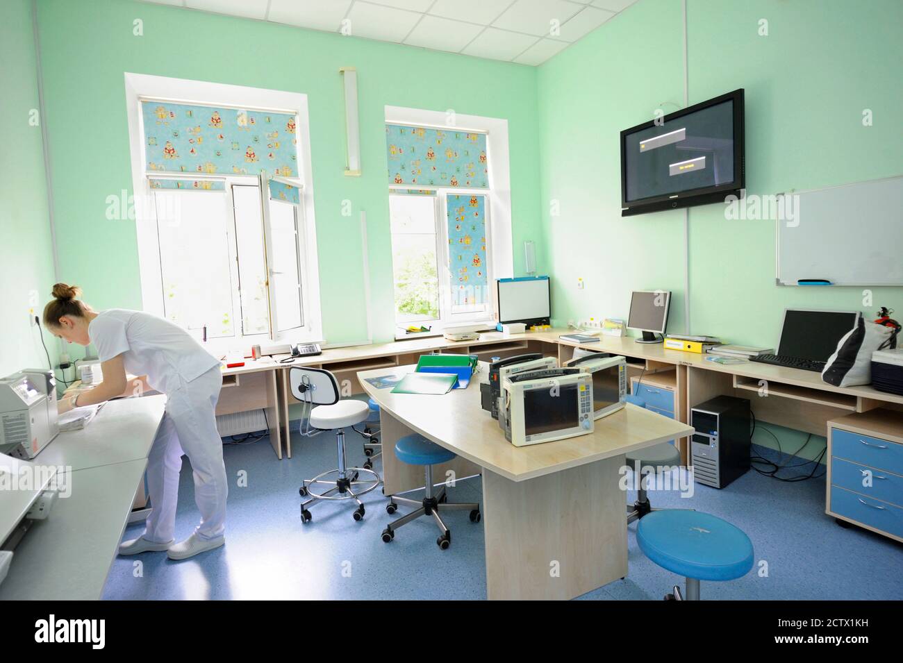 At a hospital laboratory. Lab technician performing analysis of blood