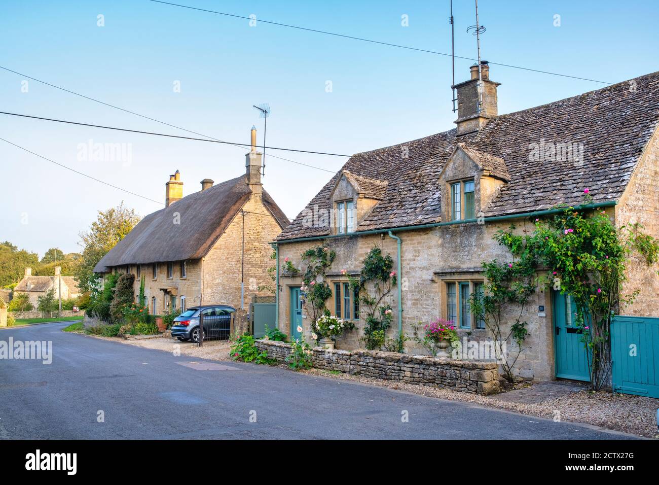 Row of cottages in a cotswold village in early autumn. Taynton, Cotswolds, Oxfordshire, England