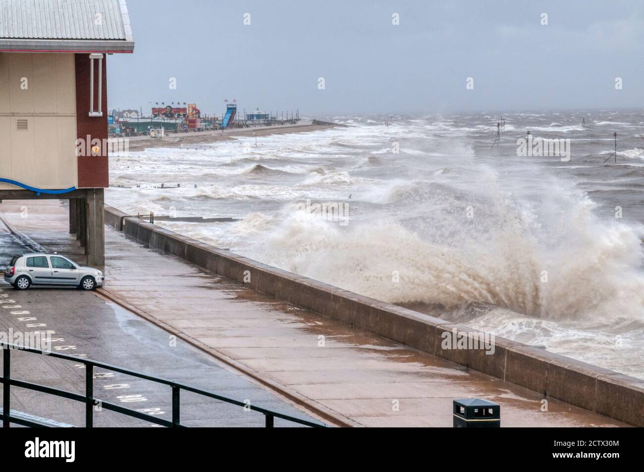 25 September 2020. UK weather.  Hunstanton, Norfolk. UK.  A severe weather warning is in place for large parts of East Anglia with winds as high as 65mph seen in Norfolk.  Photograph shows waves at high tide breaking over the promenade in front of the remains of the old pier at Hunstanton on the Norfolk coast. Credit UrbanImages-News/Alamy. Stock Photo