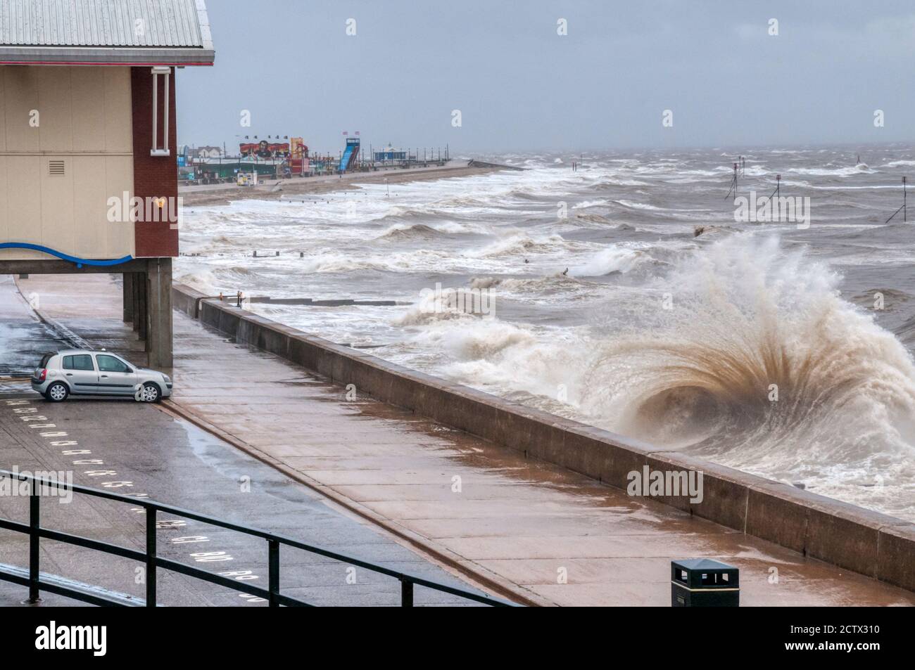 25 September 2020. UK weather.  Hunstanton, Norfolk. UK.  A severe weather warning is in place for large parts of East Anglia with winds as high as 65mph seen in Norfolk.  Photograph shows waves at high tide breaking over the promenade in front of the remains of the old pier at Hunstanton on the Norfolk coast. Credit UrbanImages-News/Alamy. Stock Photo