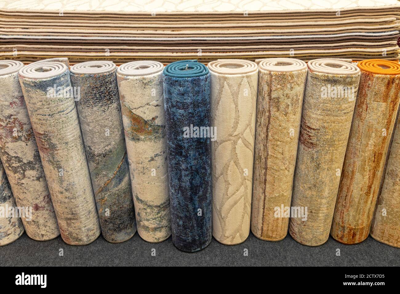 Colourful Carpets and Rugs Variety Selection in Rolls Stock Photo Alamy