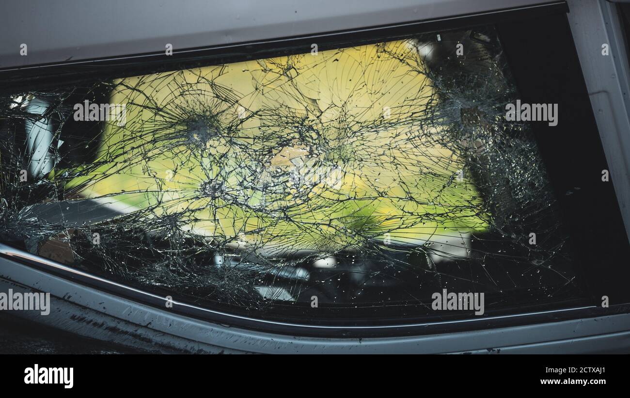 Shot of Broken Car Window after Horrific Traffic Accident. Vehicle Lying on its Roof after Collision. Stock Photo