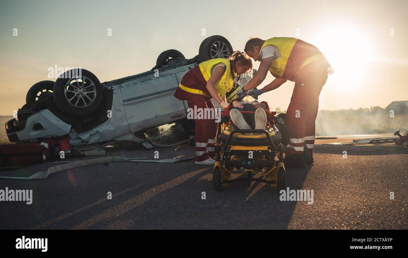 On the Car Crash Traffic Accident Scene Paramedics Saving Life of a