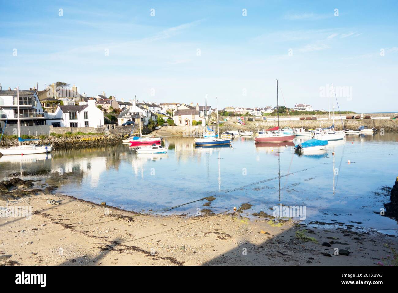 The small harbour in Cemaes Bay Anglesey Wales UK Stock Photo