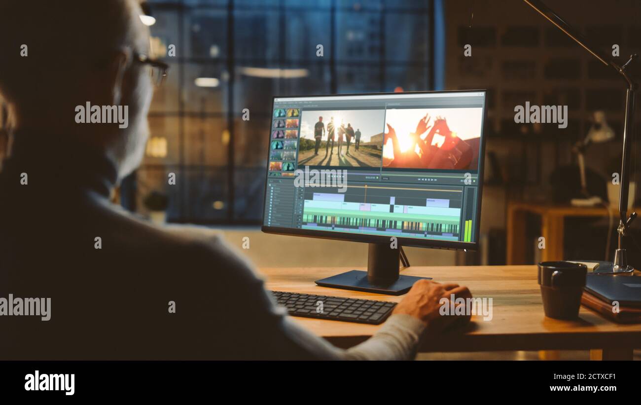 Over th Shoulder Shot Professional Middle Aged Videographer Works on