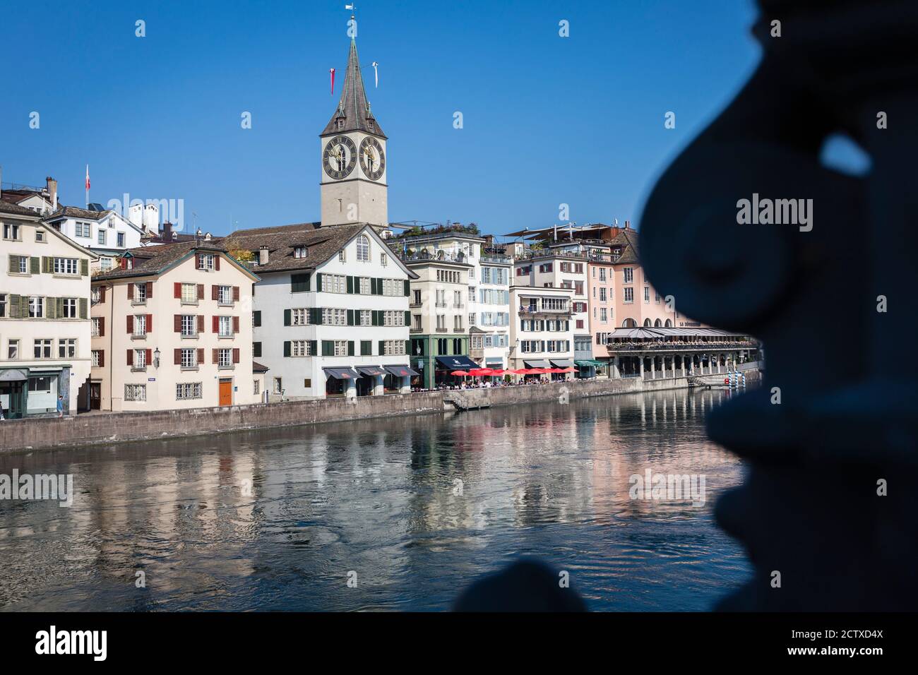 Limmat river and St. Peterskirche church in Zurich, Switzerland Stock Photo