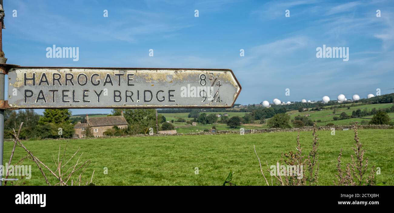 Old Harrogate and Pateley Bridge signpost with Menwith Hill Golf Balls
