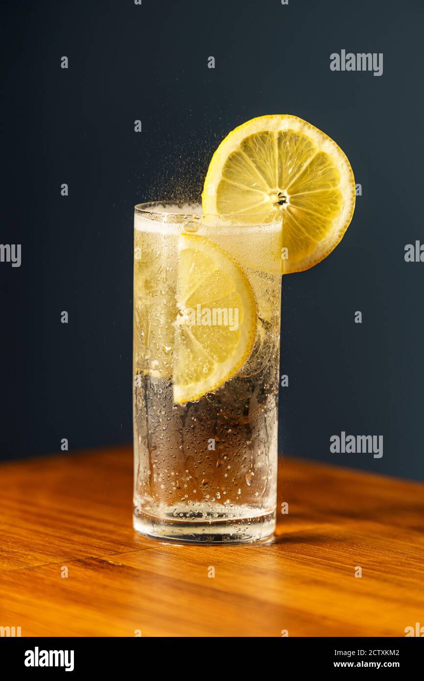 Gin Tonic Cocktail. Gin, tonic, lemon wedge, ice and bitter. Cocktail