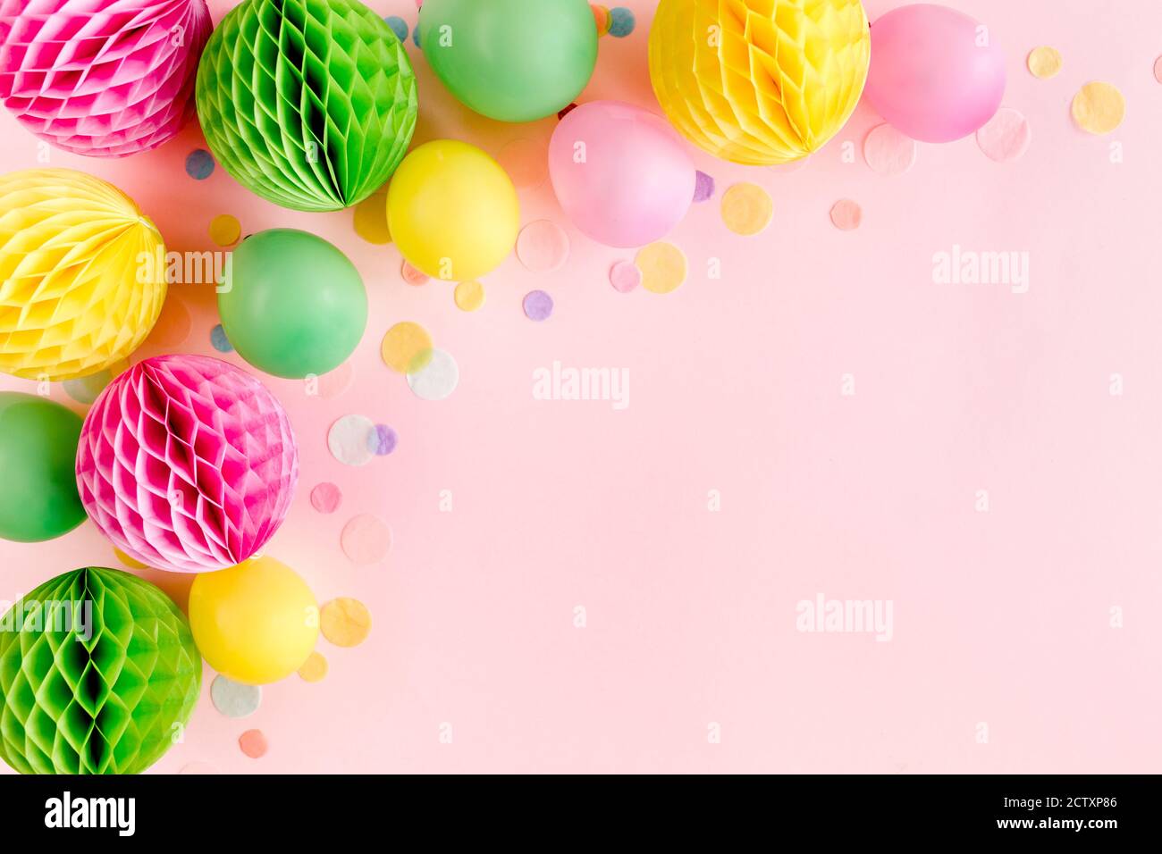 Party background with streamers and confetti on pastel pink background. Birthday  party decoration Stock Photo - Alamy