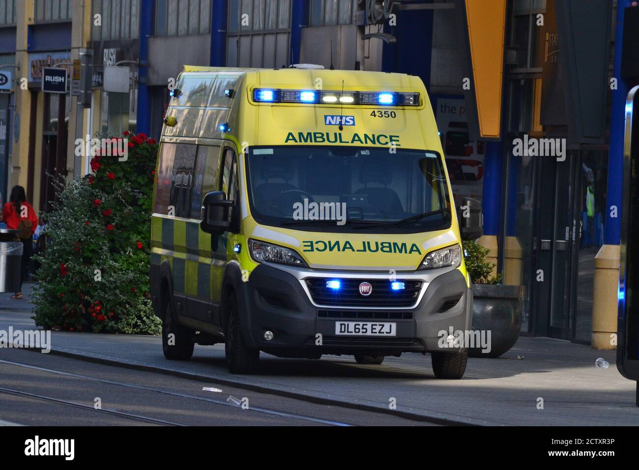 West Midlands Ambulance Service paramedics attend an incident in Birmingham City Centre, UK, on Corporation Street Stock Photo