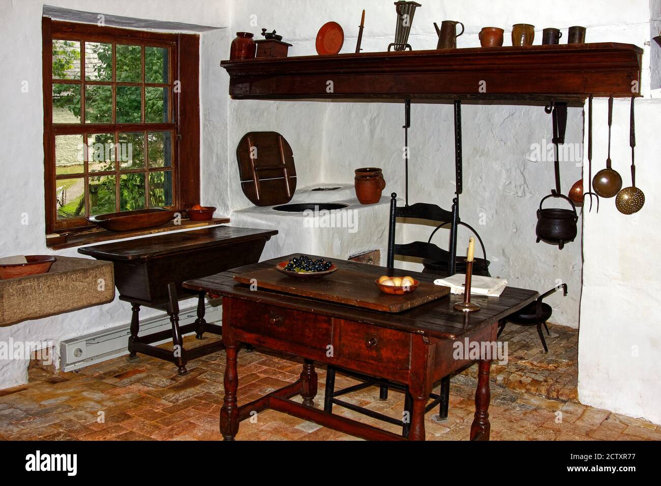 old kitchen, hearth, antique cooking implements, old table, oven, dough box, Saron, Sisters' House, Ephrata Cloister, Lancaster County, Pennsylvania, Stock Photo
