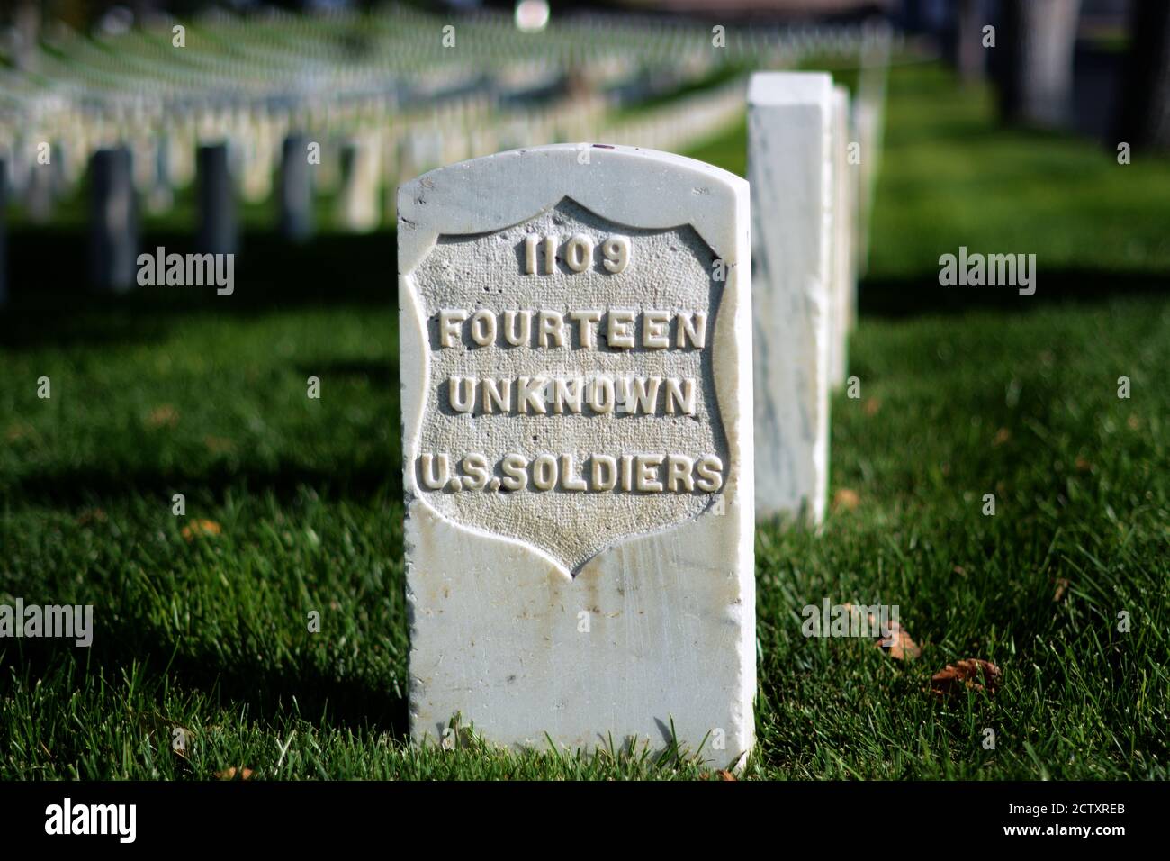 A tombstone marks the mass grave of 14 unknown U.S. soldiers who died in American's Civil War in the 1860s. Stock Photo