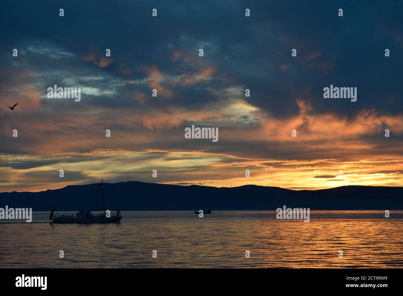 Ship on Lake Baikal at Sunset (Listvyanka, Russia) Stock Photo