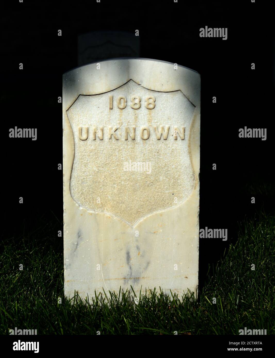 A 19th century tombstone marks the grave of an unknown person buried at Santa Fe National Cemetery in Santa Fe, New Mexico. Stock Photo