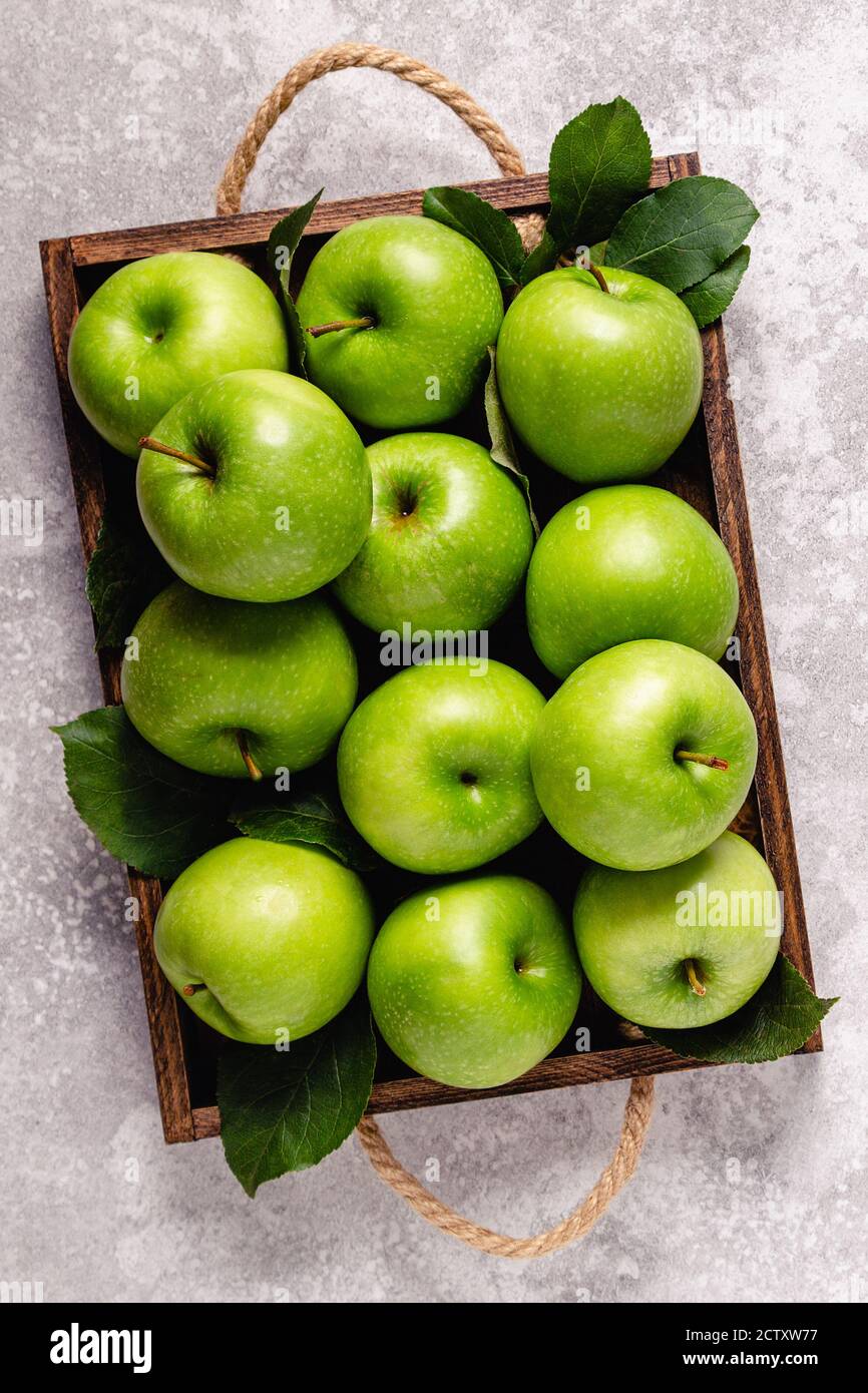 Ripe green apples in wooden box. Top view with copy space Stock Photo ...