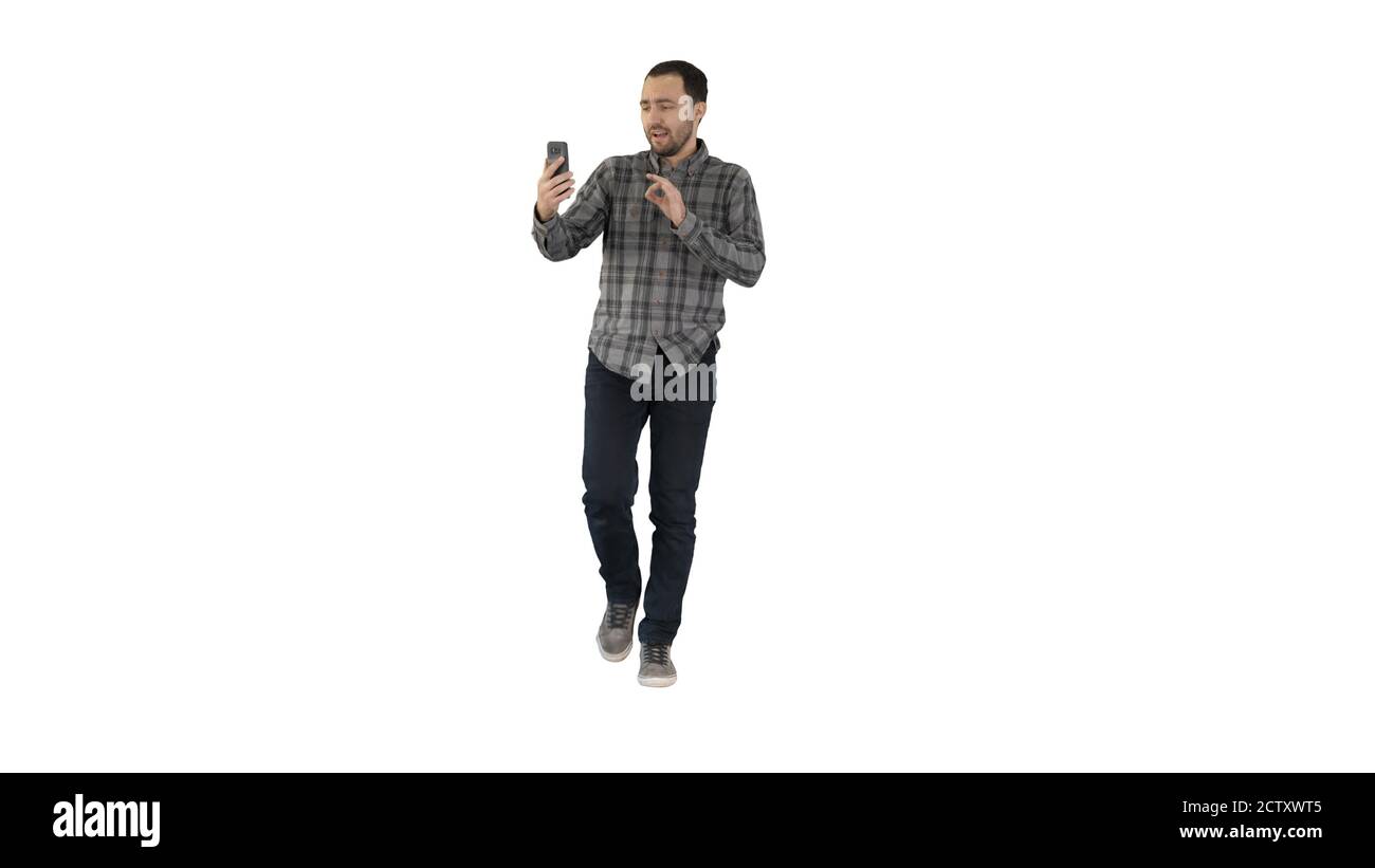 Man calling via video call on phone talking to someone waving he Stock Photo
