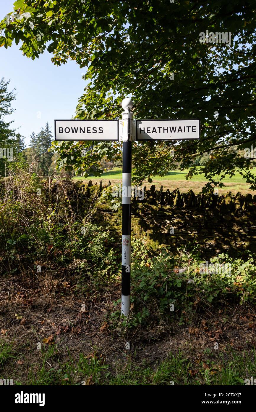 Country road sign pointing to Bowness and Heathwaite in the Lake District near Bowness on Windemere, Cumbria, UK on 20 September 2020 Stock Photo