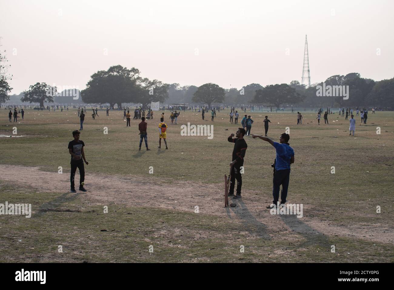 Kolkata, India - February 2, 2020: Unidentified people plays cricket in Maidan Park on February 2, 2020 in Kolkata, India Stock Photo