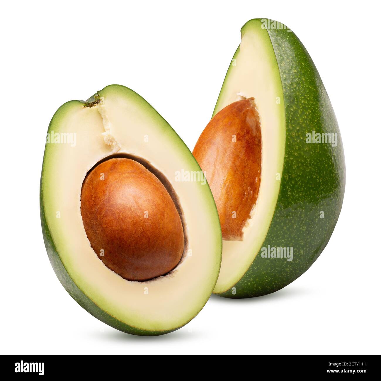 two halves of avocado isolated on a white background. Stock Photo
