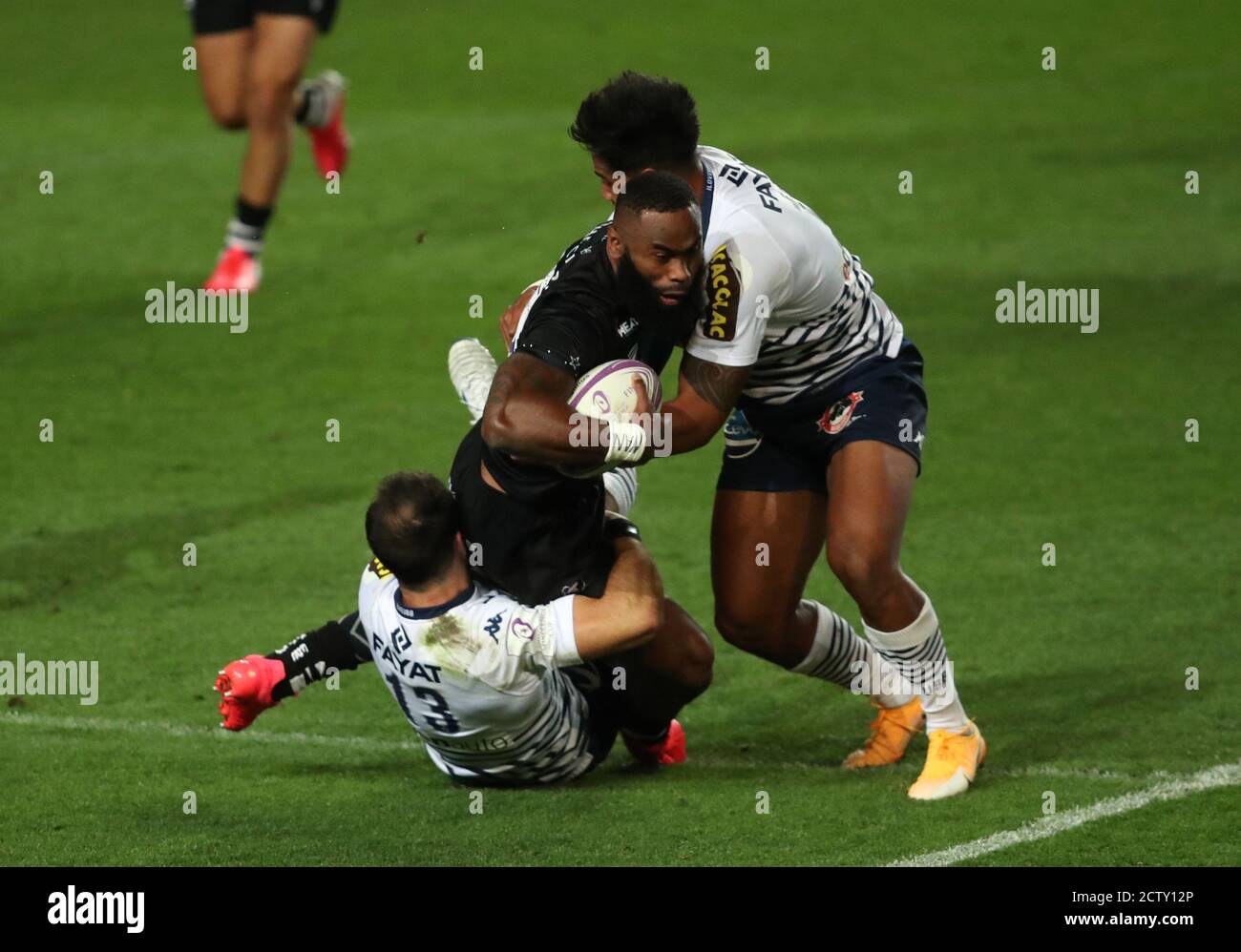 Bordeaux Begles' Ulupano Seuteni (left) and Jean-Baptiste Duble (right) tackle Bristol's Semi Radrada during the European Challenge Cup semi final match at Ashton Gate, Bristol. Picture date: Friday September 25, 2020. See PA story RUGBYU Bristol. Photo credit should read: David Davies/PA Wire. Stock Photo