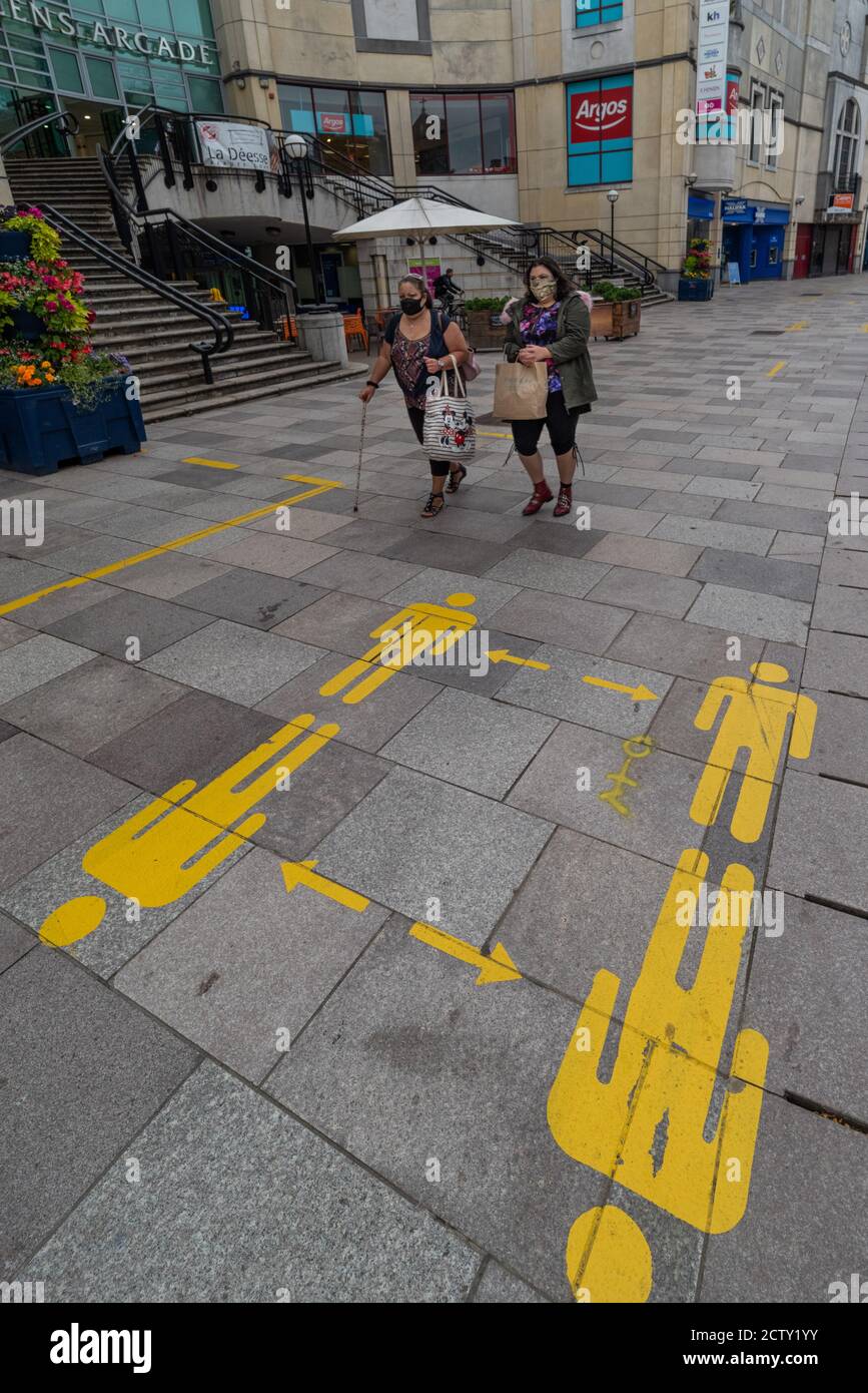 Cardiff Covid-19 lockdown social distance pavement markings Stock Photo