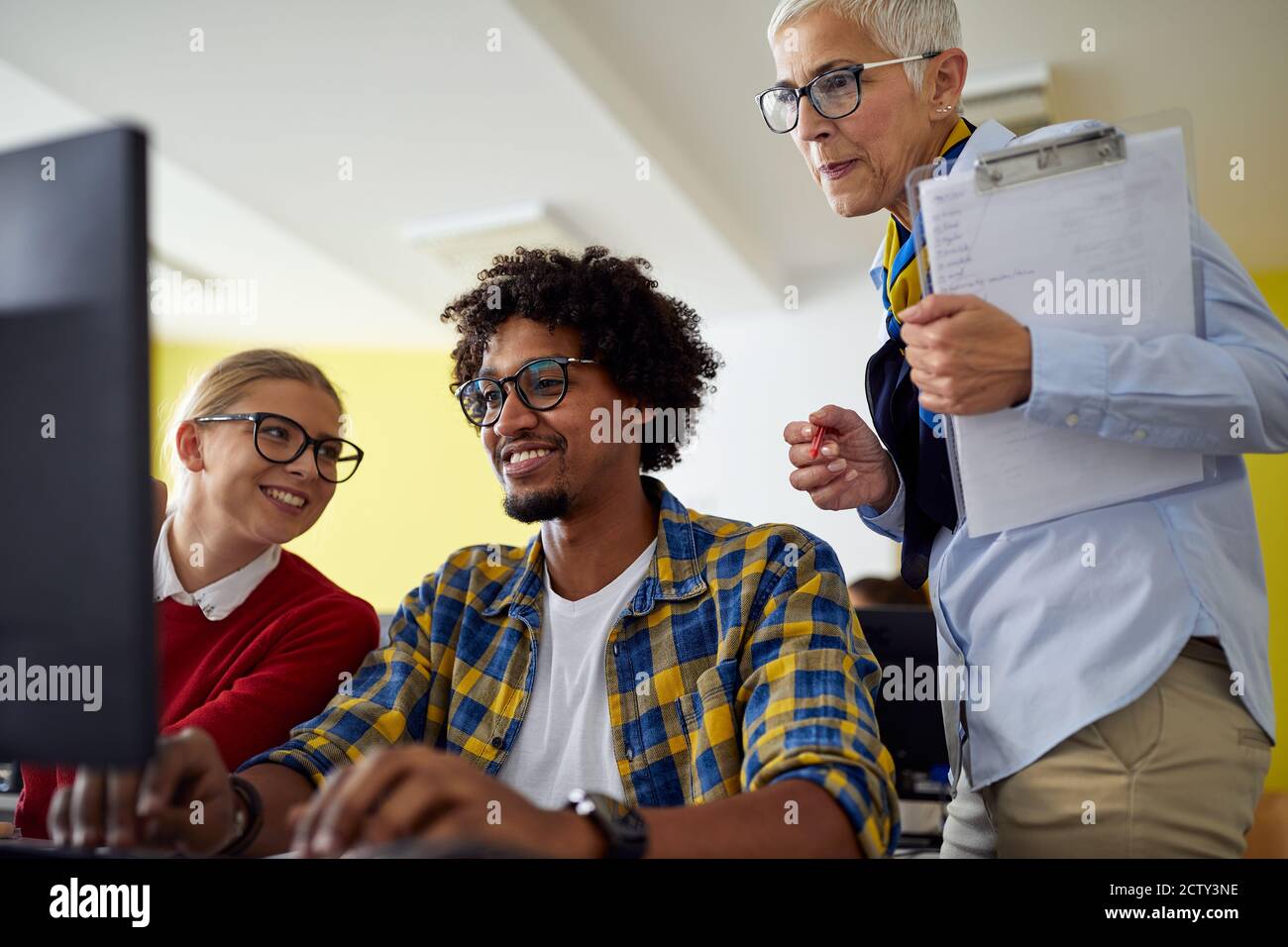 Female professor checking students hires stock photography and images