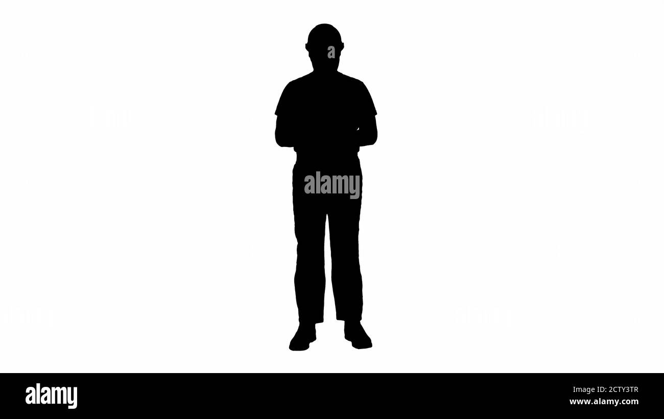 Silhouette Builder counting money standing. Stock Photo