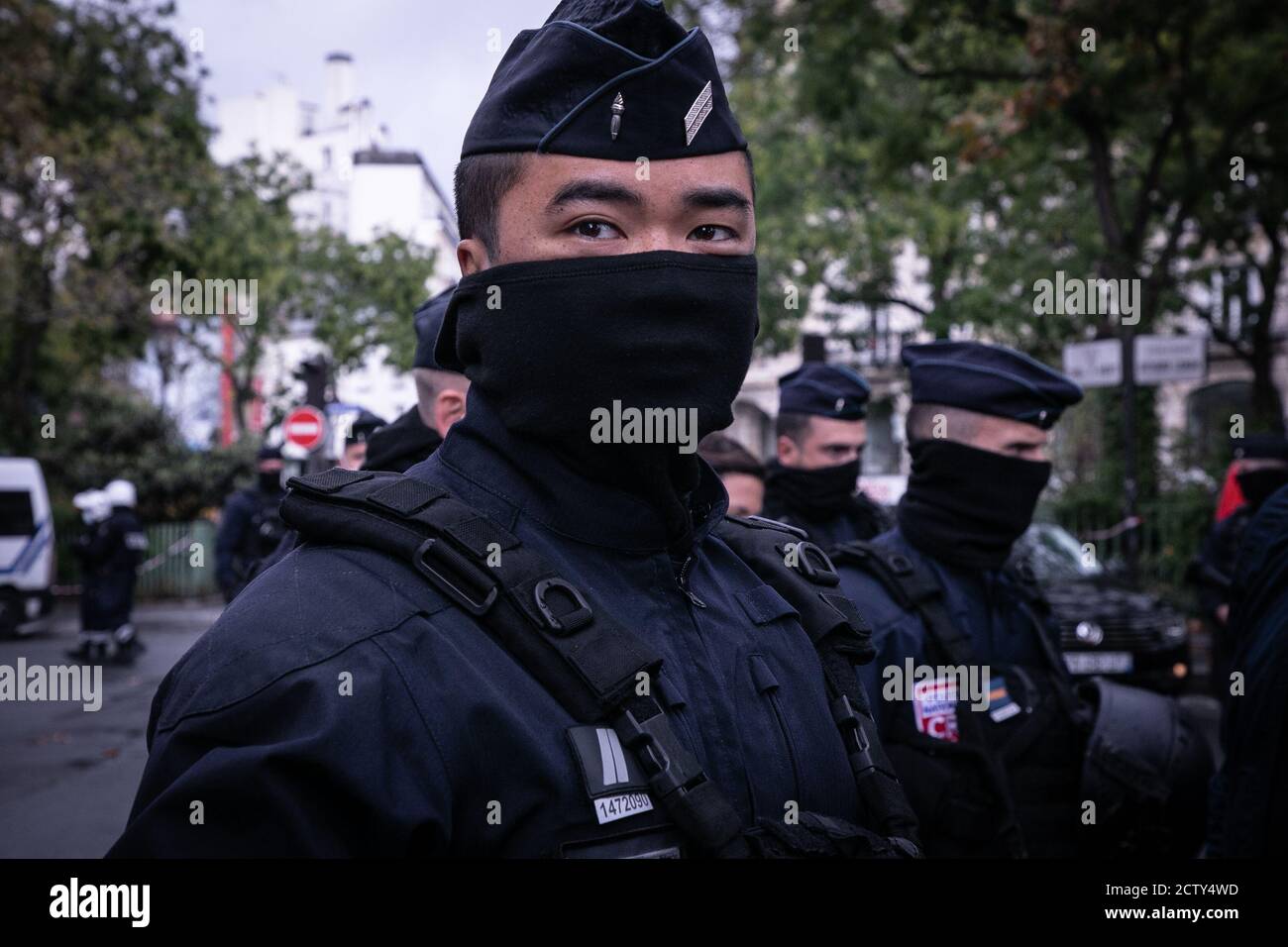 Police officer seen at the premises where the attack occurred.Paris Police deploy a security operation around the former offices of Charlie Hebdo magazine following a stabbing attack on Boulevard Richard Lenoir. Stock Photo