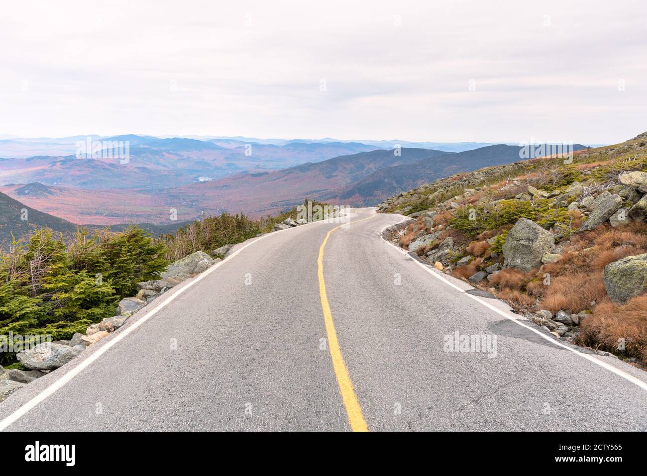 Steep winding high mountain road on an overcast autumn day Stock Photo