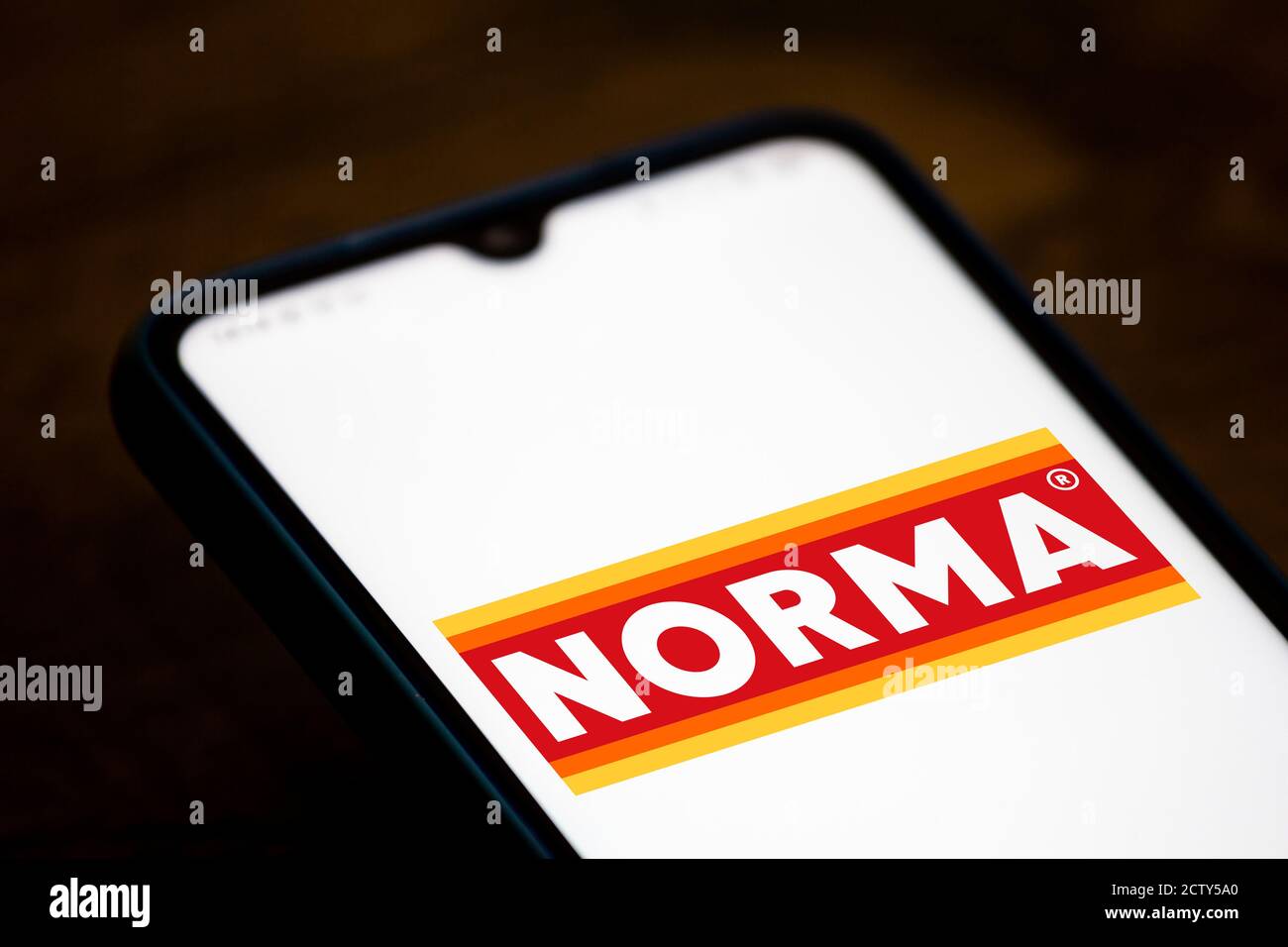 In this photo illustration the Norma logo seen displayed on a smartphone. Stock Photo