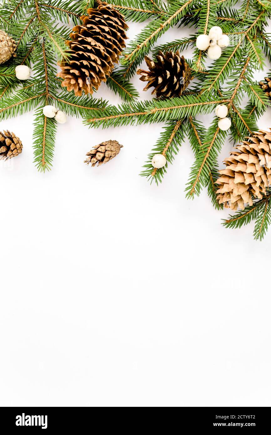 Christmas composition with fir branches, pine cones on white background ...