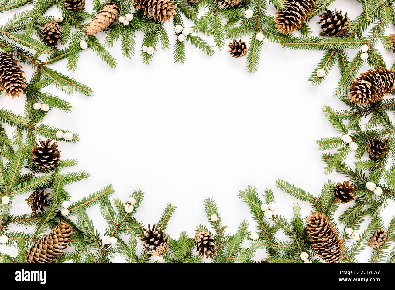Frame made of Christmas composition with fir branches, pine cones on ...