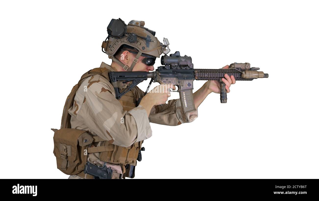 Marine walking, aiming and shooting on white background. Stock Photo