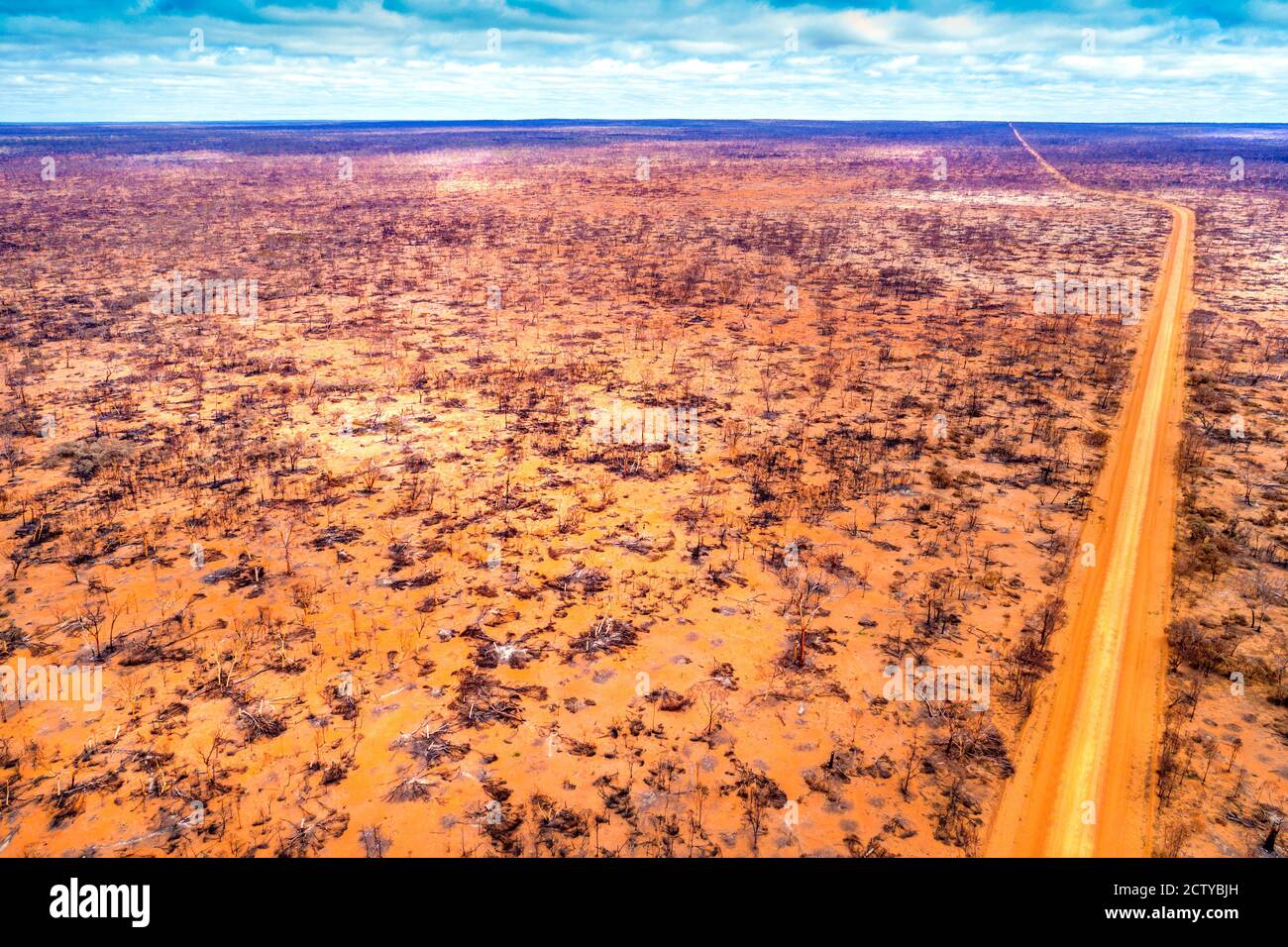 Aerial view of  Norseman to Hyden road through burnt landscape, Western Australia Stock Photo