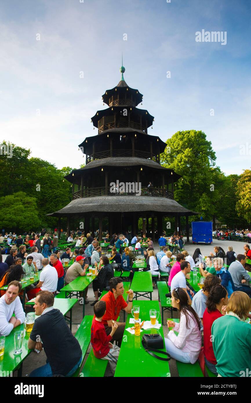 Tourists at restaurant near Chinesischer Turm with Beer Garden, Englischer Garten, Munich, Bavaria, Germany Stock Photo