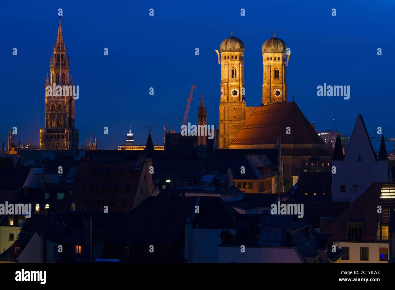 Town hall with a church at night, Munich Cathedral, New Town Hall, Munich, Bavaria, Germany Stock Photo