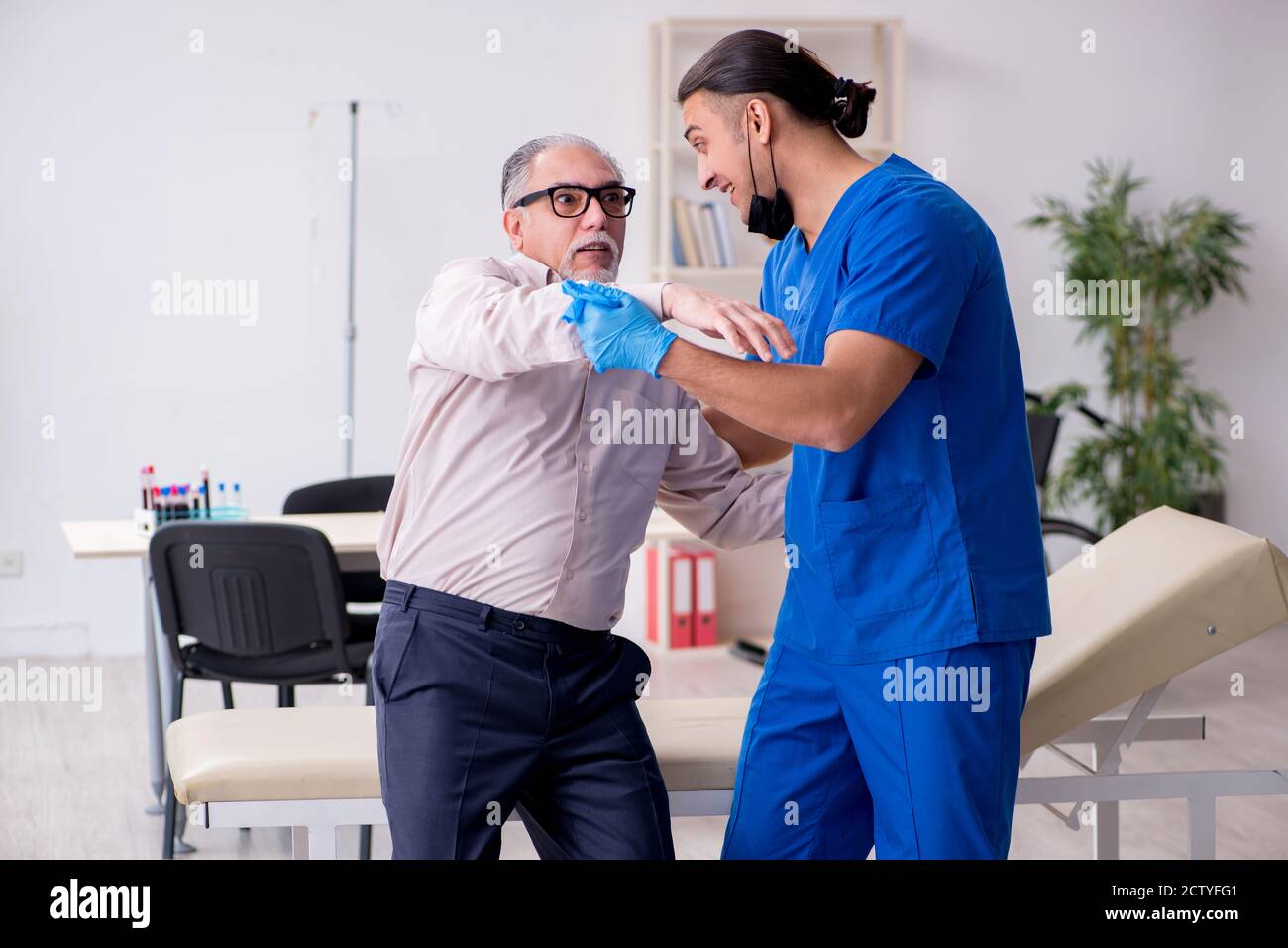 Doctor Sampling Old patient visiting young doctor in blood sampling concept Stock Photo ...